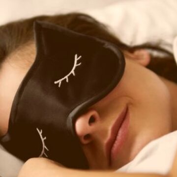 portrait-of-young-woman-with-sleep-mask-in-bed-royalty-free-image-1074270536-1565885674