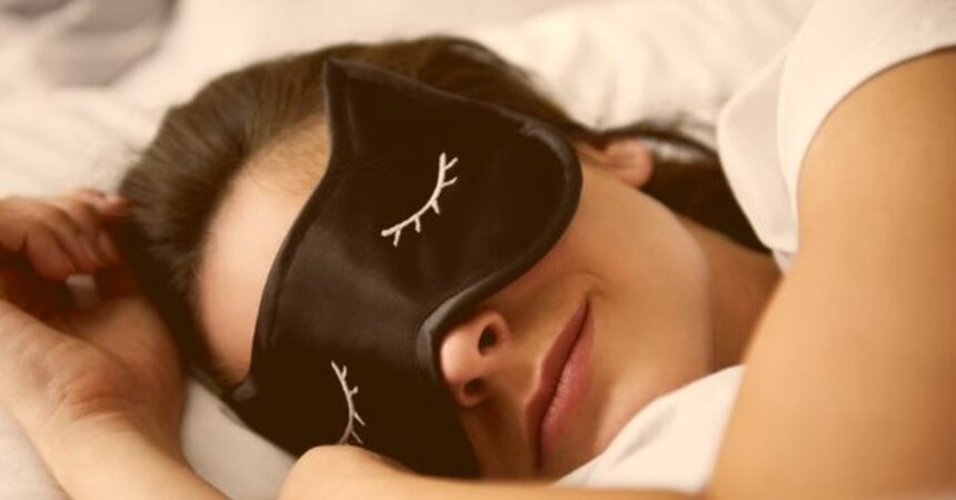 portrait-of-young-woman-with-sleep-mask-in-bed-royalty-free-image-1074270536-1565885674