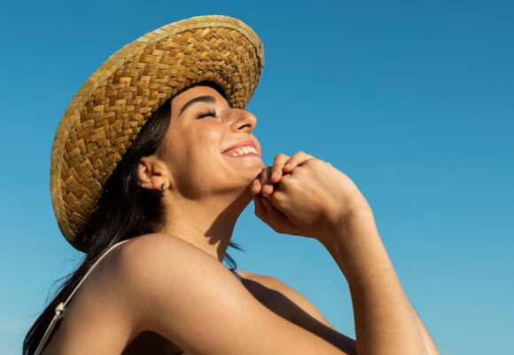 smiley-woman-posing-beach-side-view