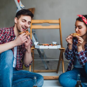 happy-couple-doing-repairs-home-have-romantic-time-eating-pizza